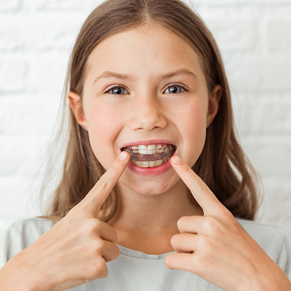 Girl with Orthodontic Appliances